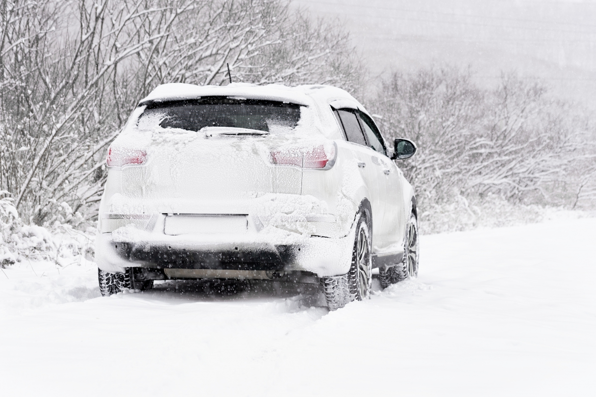 SUV Driving Through Snow