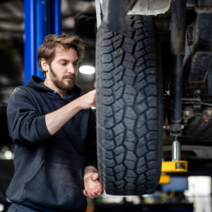 auto expert working on tire inspection