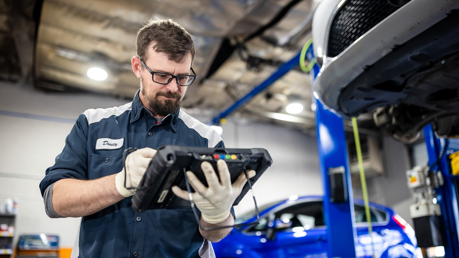 auto expert working on inspection